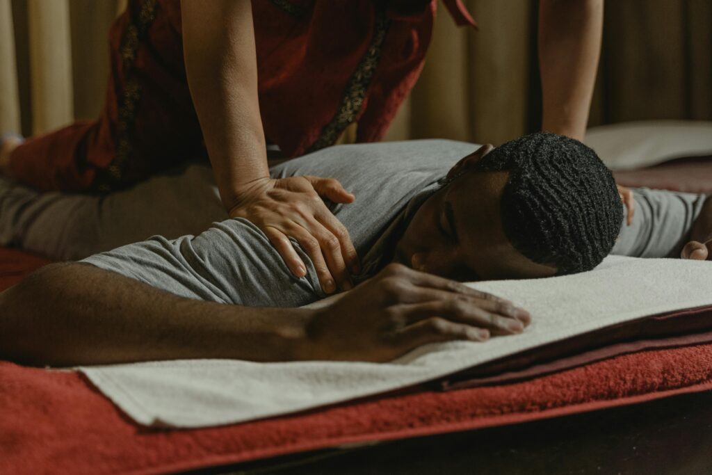 A serene spa setting featuring a massage therapy session for relaxation and rejuvenation.